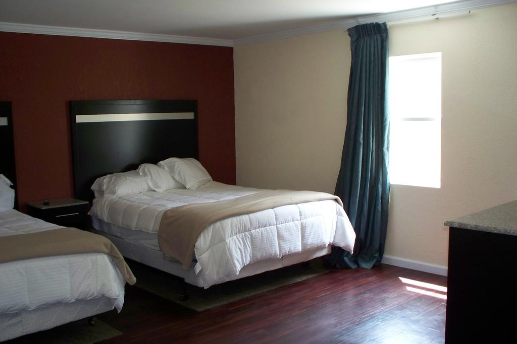 Budget Inn&Suites Wall Exterior foto