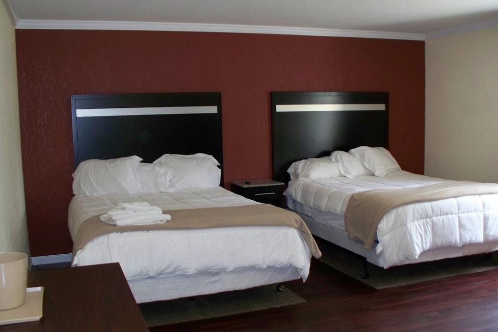 Budget Inn&Suites Wall Exterior foto